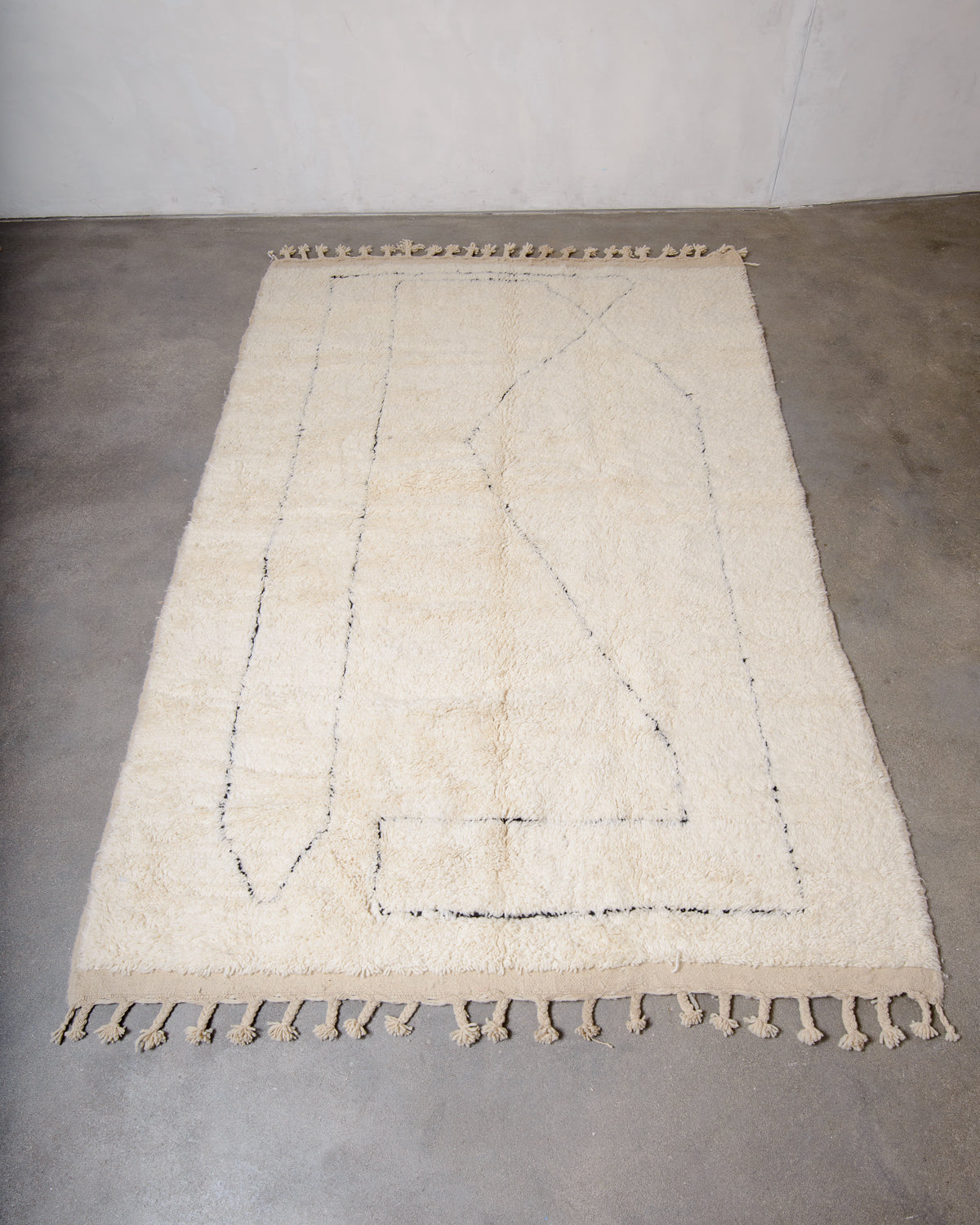 Modern, designer, handcrafted Berber rug from Morocco. Beniourain carpet with minimalist design, natural wool pile and a fluffy texture.
